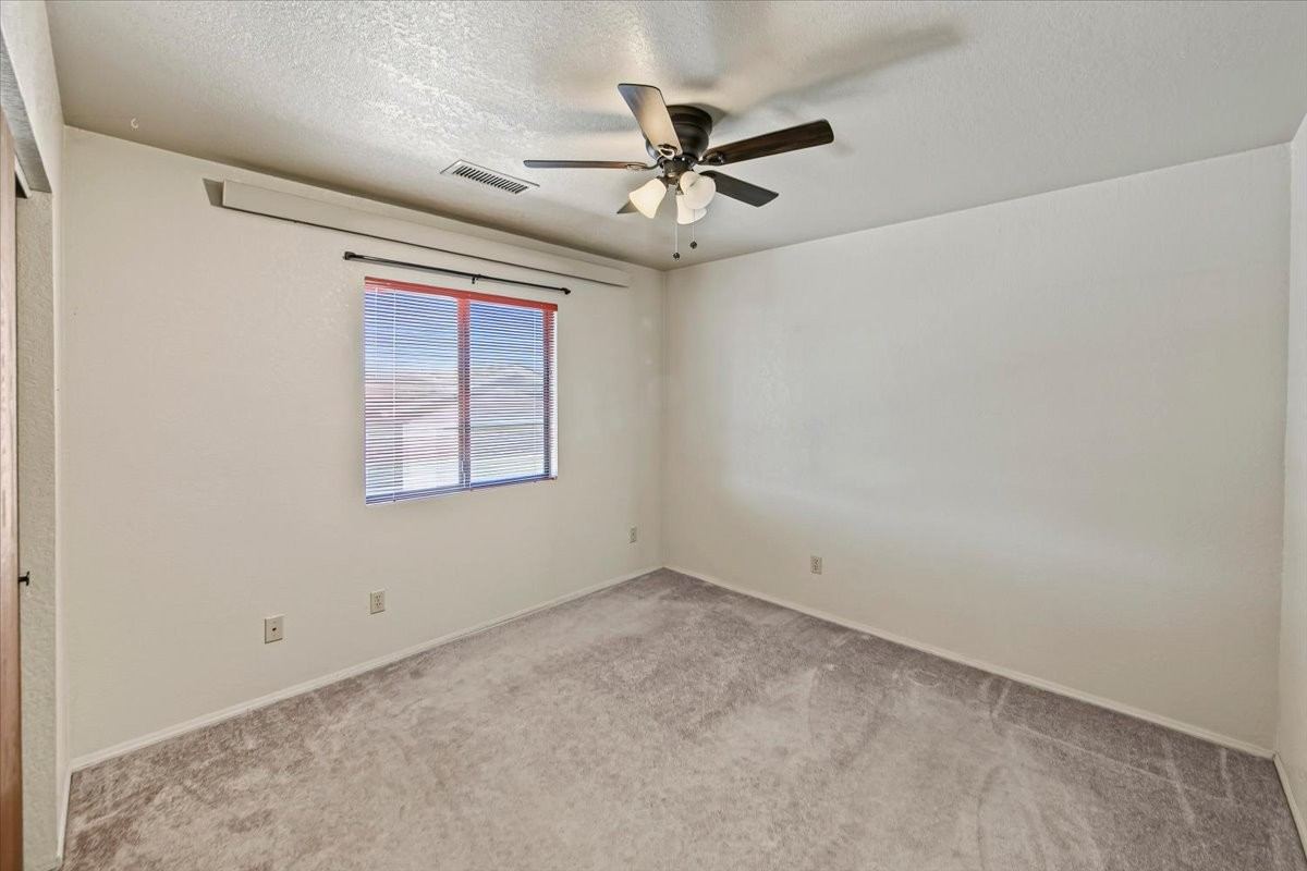 Third bedroom with a ceiling fan at 4184 N Kearny Dr