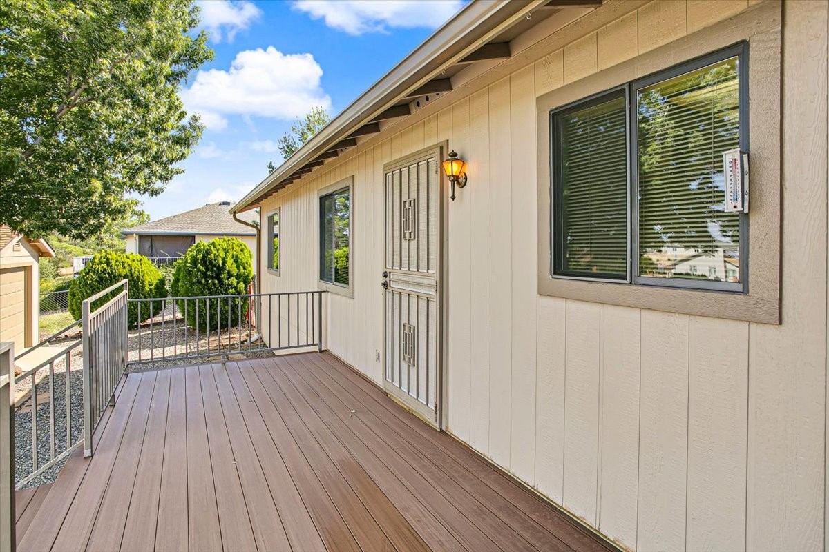 New elevated rear deck at 4184 N Kearny Dr beside the back of the house