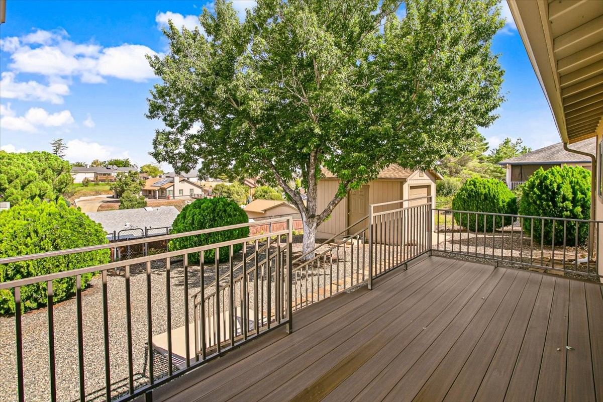 New elevated rear deck looking out over the yard and mature tree at 4184 N Kearny Dr