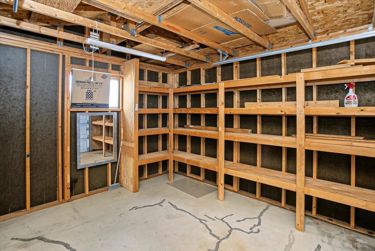 Inside the detached powered workshop with built-in shelving at 4184 N Kearny Dr